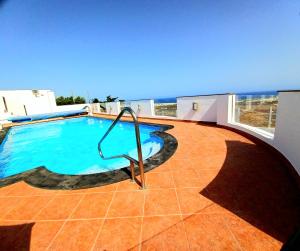 Bazén v ubytování Villa Vista Mar II, 280 qm, heated Pool, HotTube, Gaming Room, fast Internet, Meerblick nebo v jeho okolí