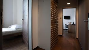 Postel nebo postele na pokoji v ubytování Arena Hotel Samorin