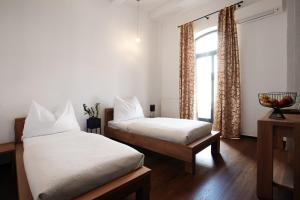 Postel nebo postele na pokoji v ubytování Arena Hotel Samorin