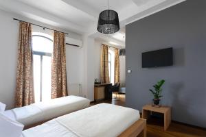 Postel nebo postele na pokoji v ubytování Arena Hotel Samorin