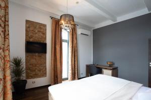 Postel nebo postele na pokoji v ubytování Arena Hotel Samorin