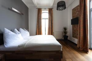 Postel nebo postele na pokoji v ubytování Arena Hotel Samorin