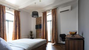 Postel nebo postele na pokoji v ubytování Arena Hotel Samorin