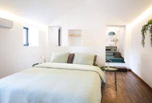 Ein Bett oder Betten in einem Zimmer der Unterkunft Alegria Cool House