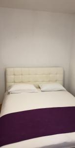 Apartments Kore tesisinde bir odada yatak veya yataklar
