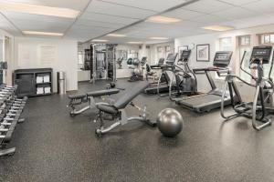 a gym with several treadmills and elliptical machines at The Inn at Virginia Tech - On Campus in Blacksburg