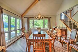 a dining room with a wooden table and chairs at Copper Mountain Home with Hot Tub Walk to Ski Lift! in Copper Mountain