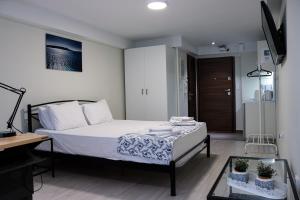 Posteľ alebo postele v izbe v ubytovaní Studio City Center