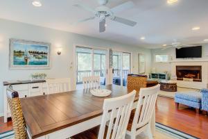 a dining room and living room with a table and chairs at Goldie's Retreat in Edisto Beach