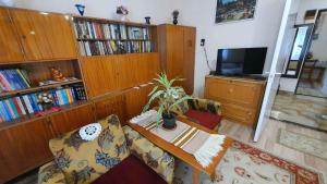 A television and/or entertainment centre at Holiday home in Siofok - Balaton 38173