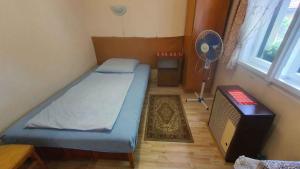 A bed or beds in a room at Holiday home in Siofok - Balaton 38173