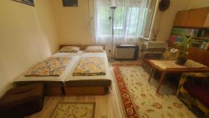 A bed or beds in a room at Holiday home in Siofok - Balaton 38173