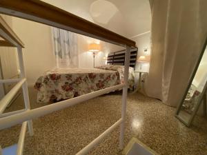 Posteľ alebo postele v izbe v ubytovaní La Casa degli Alberi