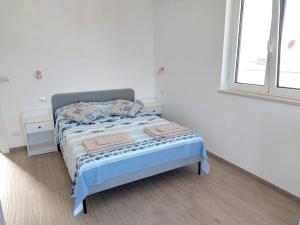 Postel nebo postele na pokoji v ubytování La terrazza di Elena