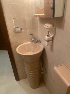 a bathroom with a sink and a toilet at Chalet in Belagio Ain Sokhna in Ain Sokhna