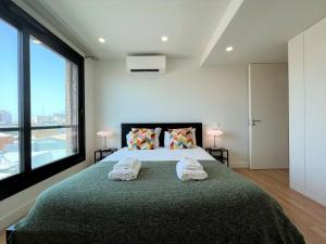 מיטה או מיטות בחדר ב-Faro Design 3 by Homing