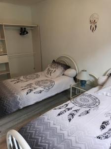Ένα ή περισσότερα κρεβάτια σε δωμάτιο στο Maison pavillonnaire