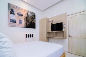 TV a/nebo společenská místnost v ubytování Hotel Gallery Cartagena