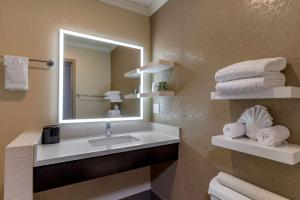 a bathroom with a sink and a mirror and towels at Best Western Silicon Valley Inn in Sunnyvale +31 photos