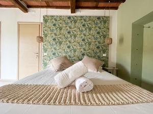 Postel nebo postele na pokoji v ubytování NEW! -Verderame Rooms & Suite in Lucca