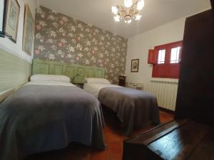Ένα ή περισσότερα κρεβάτια σε δωμάτιο στο Riojania Heredad