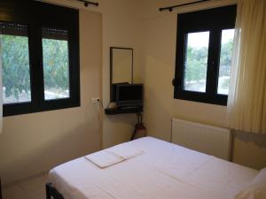 Cama ou camas em um quarto em Portela Apartments Kampoula