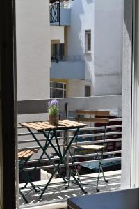 A balcony or terrace at Olive - HappyHostGr - Downtown Apartment