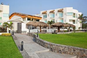 A garden outside Artisan Family Hotels and Resort Collection Playa Esmeralda