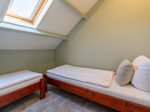 Postel nebo postele na pokoji v ubytování Tiny house Koolmees