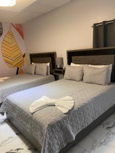 Itza-Bella Suites 객실 침대