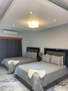 Itza-Bella Suites 객실 침대