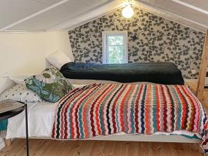 A bed or beds in a room at Holiday home UDDEVALLA XXVIII