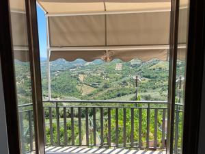 a window with a view of a mountain at Agriturismo Baccanale in Prignano Cilento