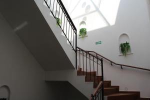 a staircase in a building with a skylight at Hotel Casa Peregrina in Tapalpa +42 photos