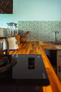 a kitchen counter with a blender on top of it at Kayuma Villas Lombok in Selong Belanak