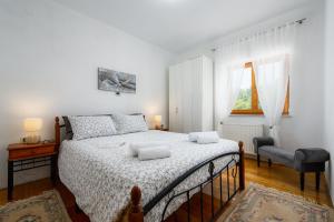 Posteľ alebo postele v izbe v ubytovaní Apartment Paradiz + 32 fotografií