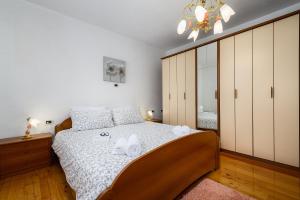 Postel nebo postele na pokoji v ubytování Apartment Paradiz