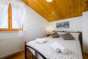 Postel nebo postele na pokoji v ubytování Apartment Paradiz