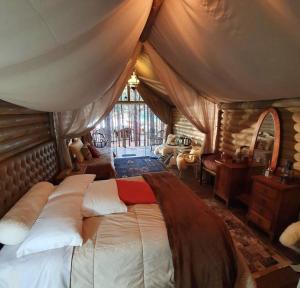 a bedroom with a large bed in a tent at Tedesco Eco Park in São Francisco de Paula