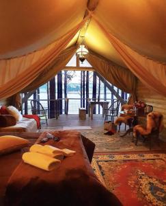 a bedroom with a bed in a tent at Tedesco Eco Park in São Francisco de Paula