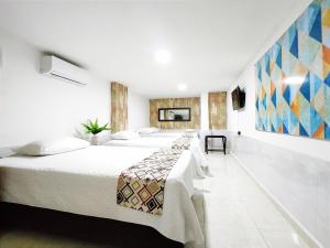 Ein Bett oder Betten in einem Zimmer der Unterkunft Walena Hotel