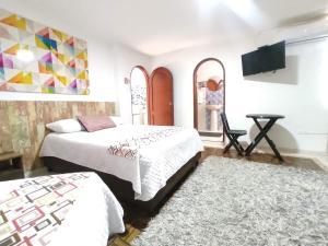 Ein Bett oder Betten in einem Zimmer der Unterkunft Walena Hotel