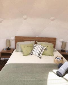 Postel nebo postele na pokoji v ubytování MAUNA Glamping