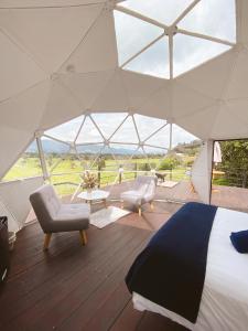 Postel nebo postele na pokoji v ubytování MAUNA Glamping