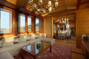 a living room with a couch and a table at Park Hyatt Ningbo Resort & Spa in Ningbo