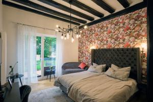 מיטה או מיטות בחדר ב-Villa Delange