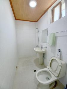 a bathroom with a toilet and a sink at Myungsung Youth Town in Gyeongju