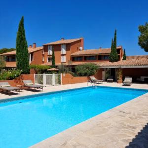 a swimming pool in front of a house at Castillon Des Baux in Maussane-les-Alpilles