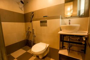 Koupelna v ubytování Coastal Pearl Hotel Miramar Panaji