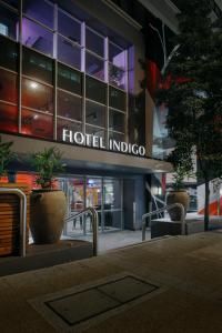 a hotel indico sign in front of a building at Hotel Indigo Brisbane City Centre, an IHG Hotel in Brisbane